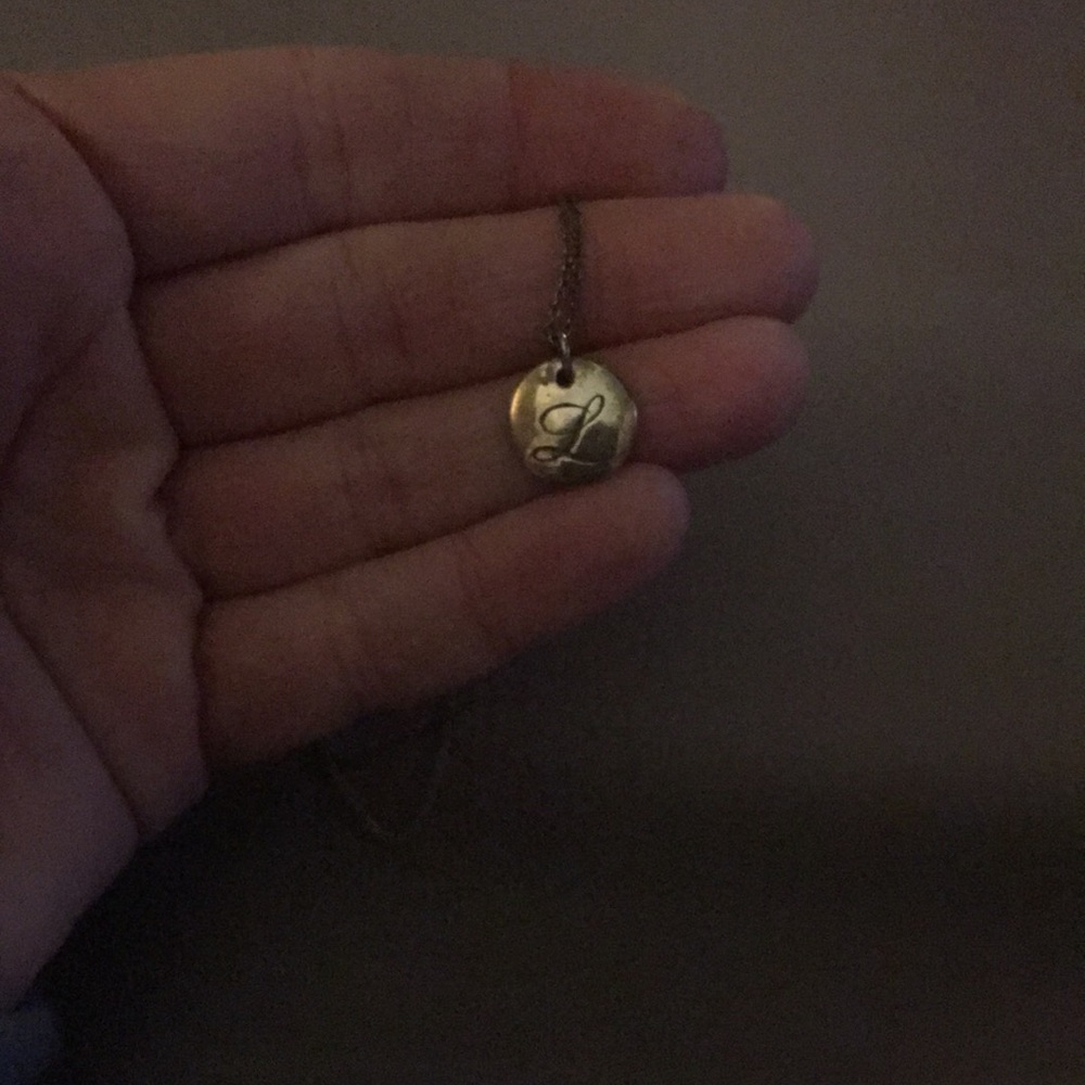 Tiffany and Co. cursive “L” necklace. I never wear